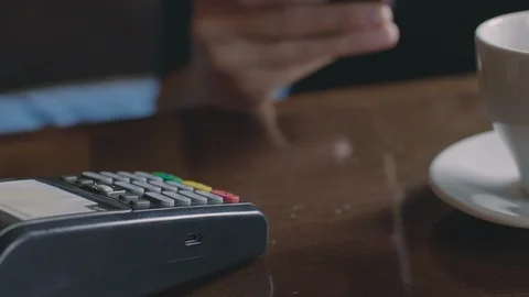 Contactless payment using card terminal and phone 스톡 동영상 92412500