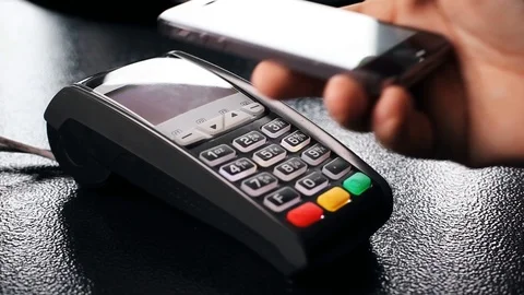 Contactless payment with your smartphone. Paying with a smartphone device Stock Footage