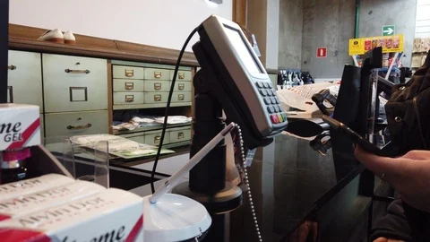 Contactless payment with your smartphone. Paying with a smartphone device on a c Stock Footage 101545278