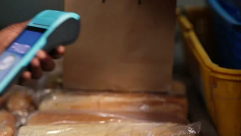 Contactless POS payment at African bakery, successful transaction Stock Footage 346565516