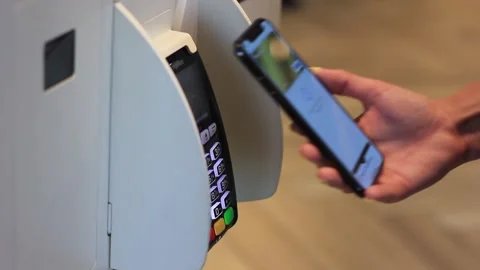 Contactless purchase at the terminal using a mobile device Stock Footage 253570981