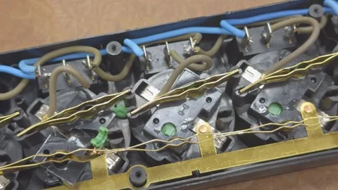 Contacts and wires inside a disassembled power strip Stock-Footage 342103415
