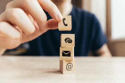 Contacts concept. Types of communication through services. Persona with cubes Stock Photos