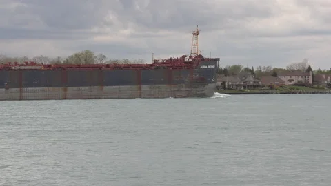 Container and cargo ship heading up river to oil refinery in Sarnia 스톡 동영상 153912762