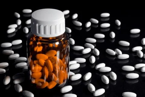 Container and pills Stock Photos
