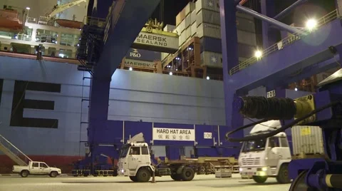 Container being loaded onto truck at night Stock Footage 1079276