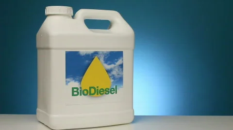 Container of Biodiesel fuel sits next to soybeans in a beaker Видео 842830