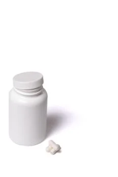 Container with capsules. White box and tabllets isolated on a white. Foto stock