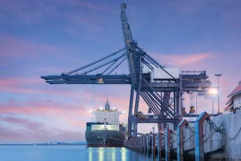 Container Cargo freight ship by crane bridge Stock Photos