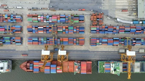 Container Cargo freight ship with working crane loading bridge Stock Footage 100883166