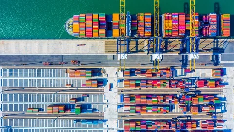 Container cargo freight ship with working crane bridge discharge at container. Stock Footage 103451605