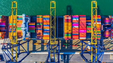 Container cargo freight ship with working crane bridge discharge at container. Stock Footage 103454646