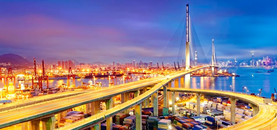 Container Cargo freight ship with working crane bridge in shipyard under Ston Stock Photos