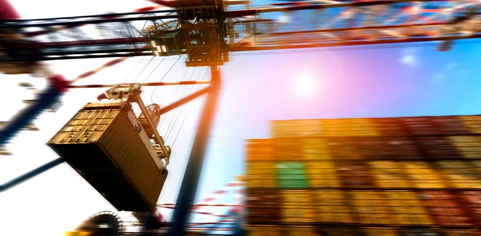 Container Cargo freight ship with working crane bridge during port operations Stock Photos