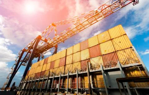 Container Cargo freight ship with working crane bridge during port operations Stock Photos