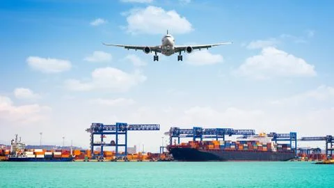 Container cargo freight ship with working crane loading bridge in shipyard, a Stock Photos