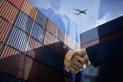 Container Cargo freight ship with working crane bridge Stock Photos