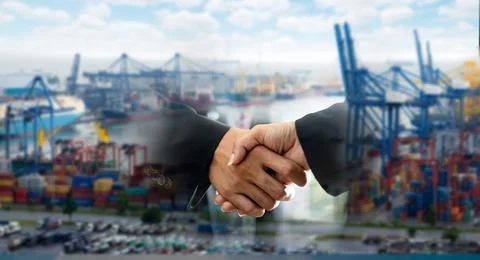 Container Cargo freight ship with working crane bridge Stock Photos