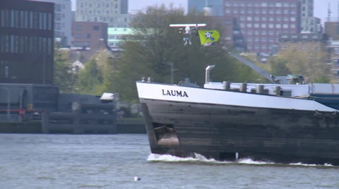 Container cargo river ship advances on the river Maas - Rotterdam Stock Footage 33523058