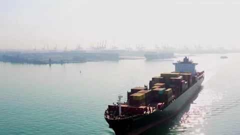 Container cargo ship boat in the open sea Freight shipping maritime. with port 스톡 동영상 336445536