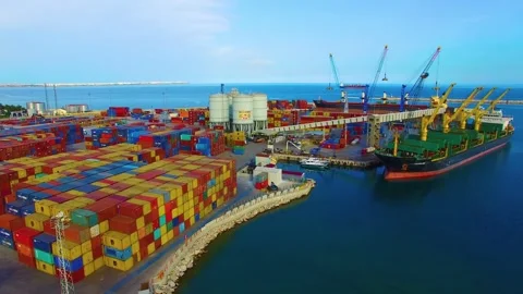 Container cargo ship at industrial port harbor in import export commercial trade Stock Footage 336445603