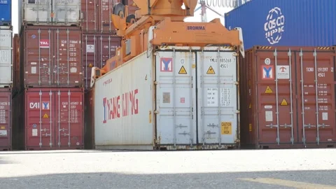 Container cargo ship loading / unloading by gantry crane 4k creative business vi Stock Footage 141912340