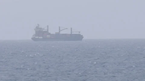 Container cargo ship makes turn offshore - time lapse Stock Footage 39577841