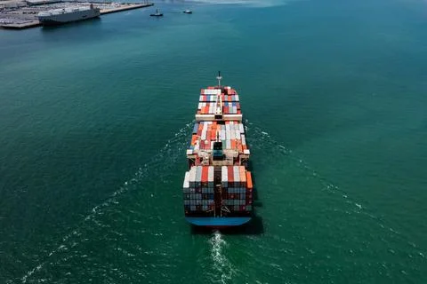 Container Cargo Ship Navigating Sea Waters Near Laem Chabang Port In Thaila.. Photos