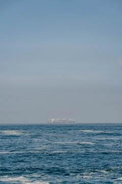 Container cargo ship in the ocean, blue sky background with copy space Foto stock