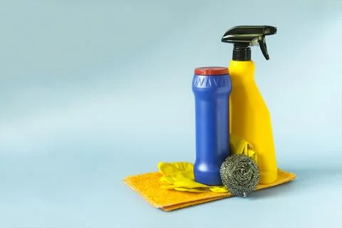 A container with cleaning agent and a container with a sprayer. Stock Photos