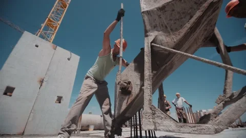 Container with a concrete moving down with a construction crane Stock Footage 143787503