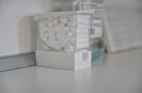 Container of Cotton rolls on a Clean Surface Stock Photos