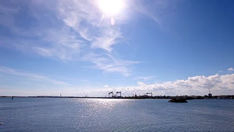 Container Crane Back Lit Silhouette and Seascape Low Angle Stock-Footage 92894796