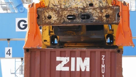 Container crane lifts shipping container - spreader zoom Stock Footage 88860202