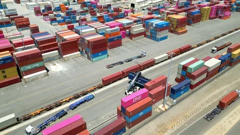 Container crane loading shipping containers onto road train at Fremantle Port Stock Footage 328218844