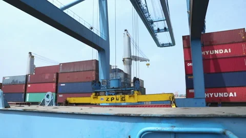 Container crane operations at the port with cargo loading in progress Stock Footage 318203739