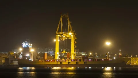 Container Crane unloading a cargo ship at night. 4K Time lapse Stock Footage 96660938