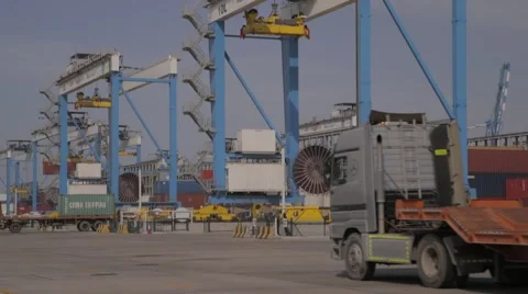 Container Cranes And Lorry Trucks Stock Footage 63086013