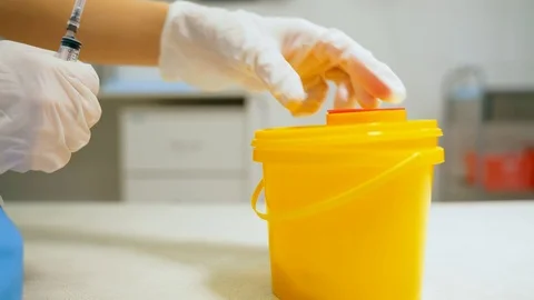 Container for disposing of used syringes. Stock Footage 100588674