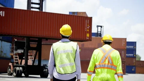 Container foreman active discuss working with engineer in factory. Stock Footage 159278780