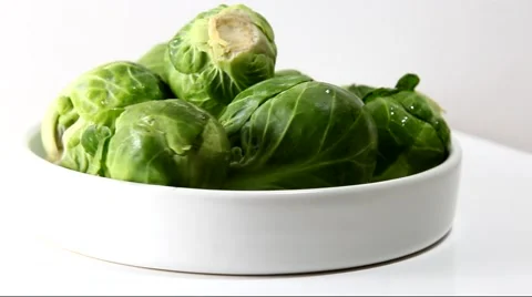 A container with fresh green Brussels sprouts Stock Footage