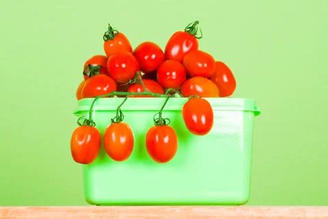 Container with fresh tomatoes Stock Photos