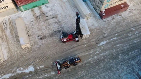 Container Handler and Snowplow in a Toronto Freight Yard 動画素材 348881726