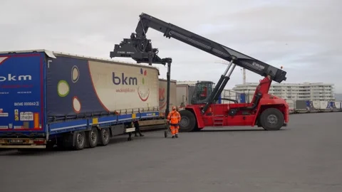 Container Handler Loading Cargo Trailer at Freight Terminal in Le Havre, France 動画素材 337976172