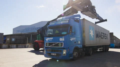 Container Handler is Loading Container onto Truck in Logistic Center. Video stock 54435412