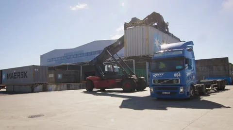 Container Handler is Loading Container onto Truck in Logistic Center. Video stock 54446701