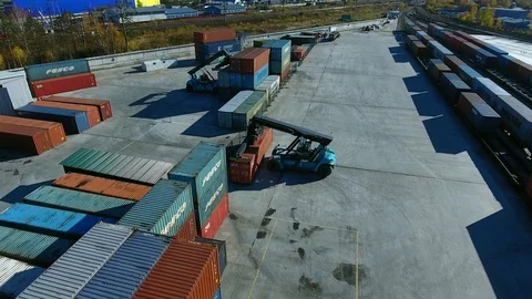 Container Handler loading move at a freight terminal. Aerial view 4k Stock Footage 97532699