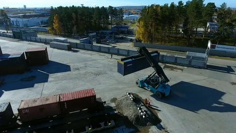 Container Handler loading move at a freight terminal. Aerial view 4k Stock-Footage 97533181