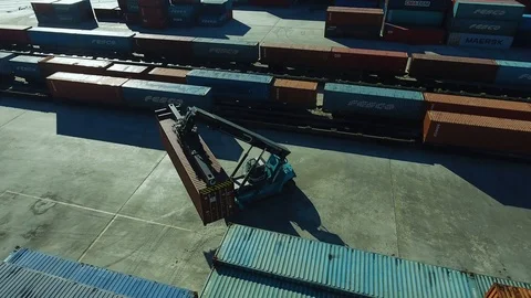 Container Handler loading move at a freight terminal. Aerial view 4k Stock-Footage 97533309