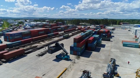 Container Handler Loading a Truck in the Terminal. UHD. 4K. Aerial view Stock Footage 123283834